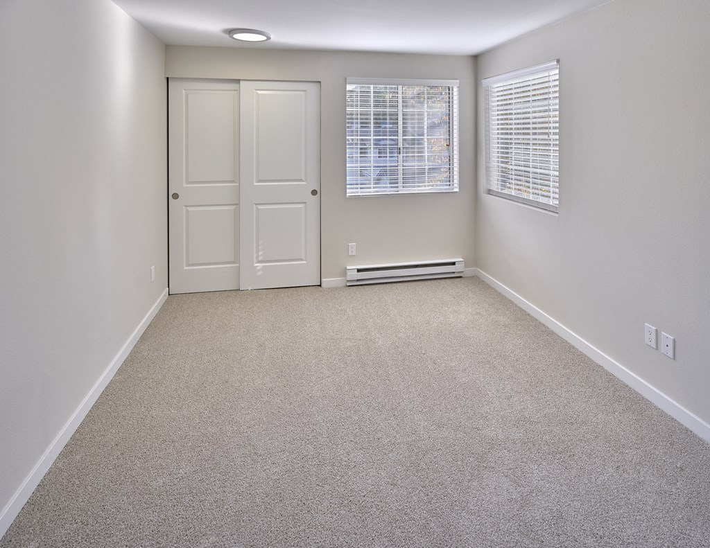 an empty room with a door and a window at Edmonds Gateway, Edmonds, WA