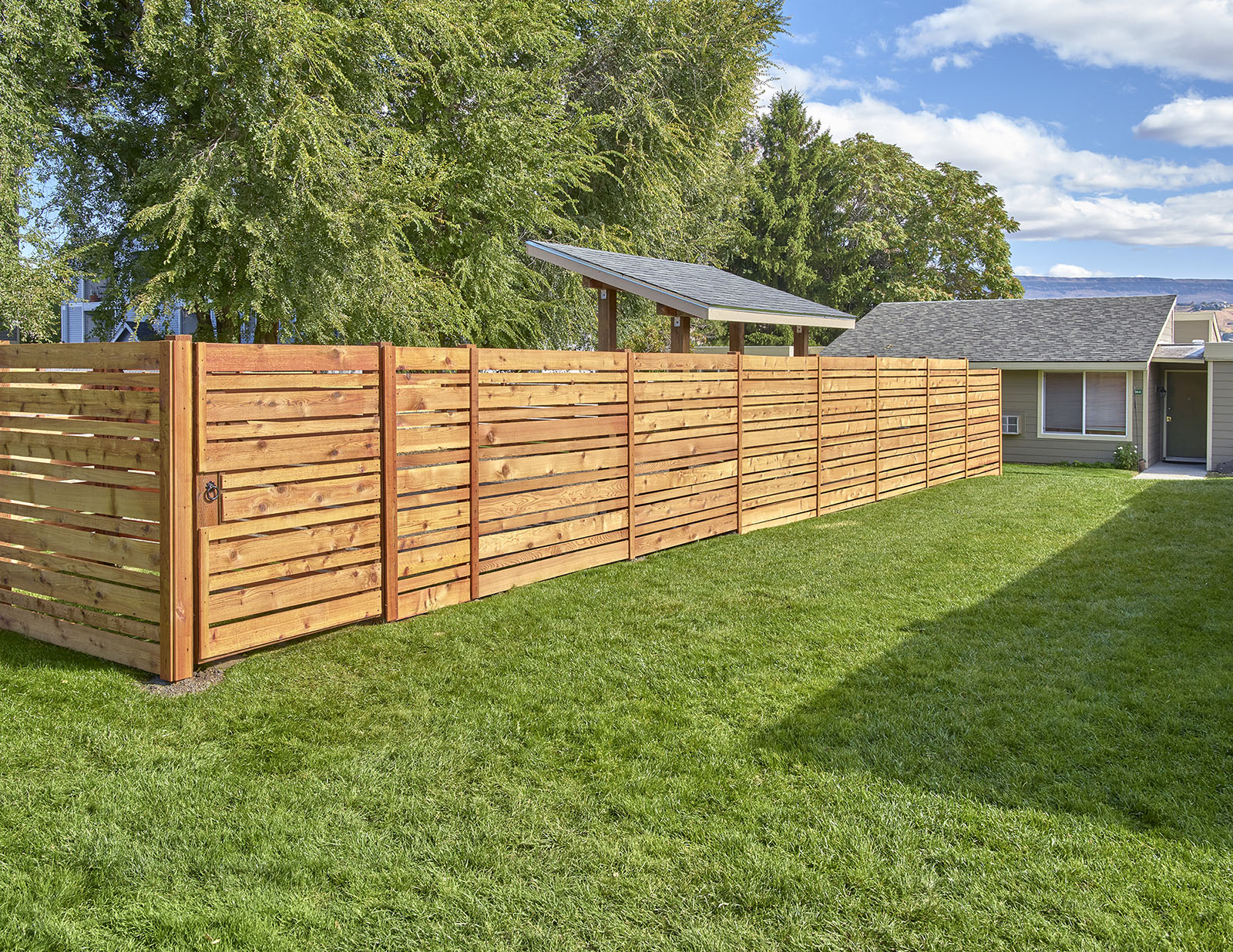 Well maintained, grassy dog run area.at Park View Apartments, Wenatchee, WA