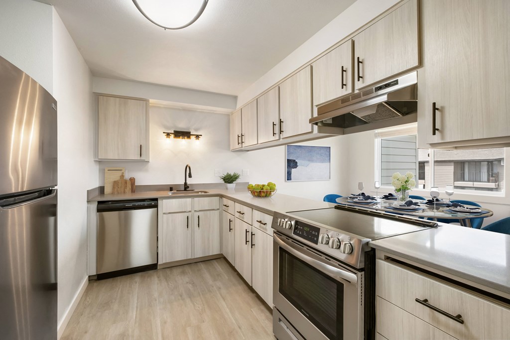 a kitchen with white cabinets and stainless steel appliances  at Brix, Walla Walla, WA, 99362