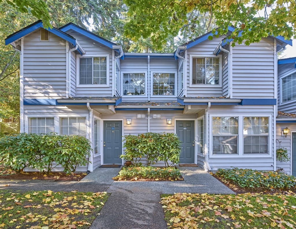 a blue and white house with a sidewalk in front of it at Edmonds Gateway, Edmonds, 98026