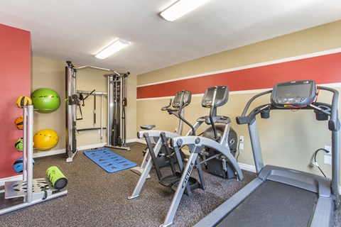 Fitness center with treadmill, elliptical, recumbent bike, cable machine and medicine balls, and foam roller at Pacific Sands, San Diego, CA, 92117