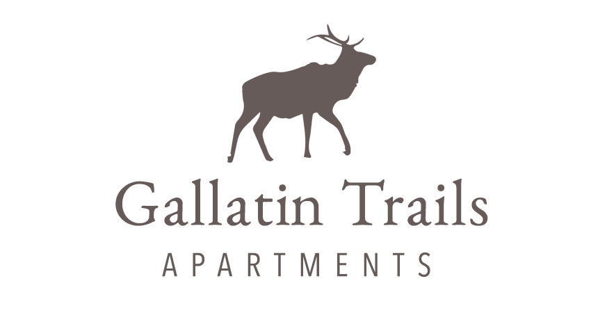 A logo for Gallatin Trails Apartments featuring a mountain goat.