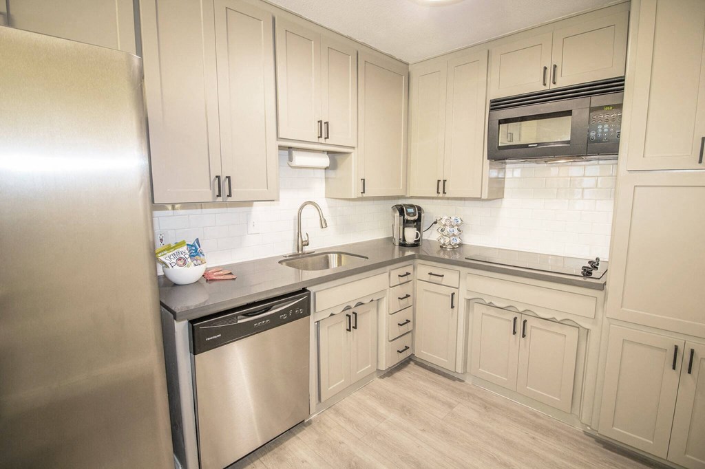 Woodland Village resident lounge with kitchen area at Woodland Village Apartments , Woodland