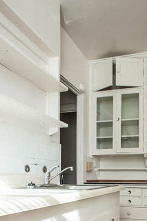Kitchen Kitchen with a sink, lots of counterspace and glass panel cabinet doors. - Photo Gallery 3