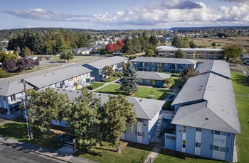 Exterior Exterior with an aerial view of the entire complex and surrounding trees. - Photo Gallery 3