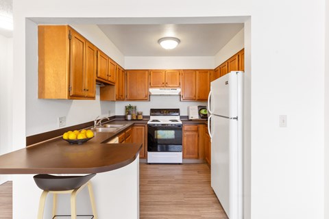 a kitchen with a counter and a refrigerator at Rock Creek, Billings, 59102