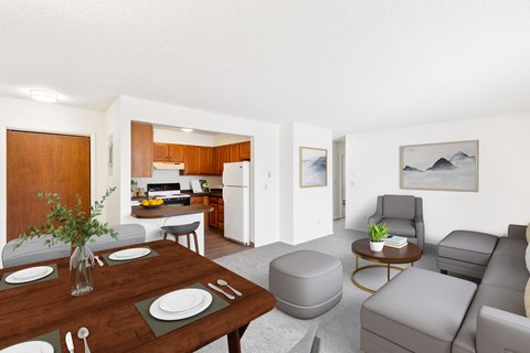 A modern living room with a dining table set for two.