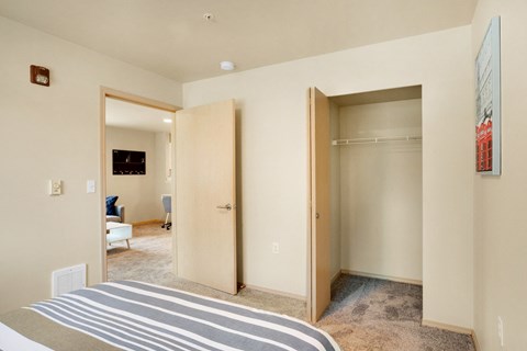 a bedroom with two closets and a bed and a carpeted floor at Sky Vue, Bellingham Washington