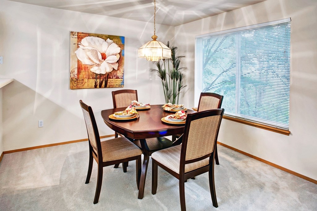 Dining space at Sunrise Lane Apartments Everett WA Dining room with table and chairs at Sunrise Lane Apartments in Everett WA