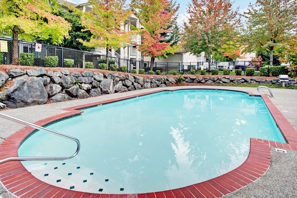 Pool at Sunrise Lane Apartments Everett WA Small outdoor pool with red trim at Sunrise Lane Apartments Everett WA
