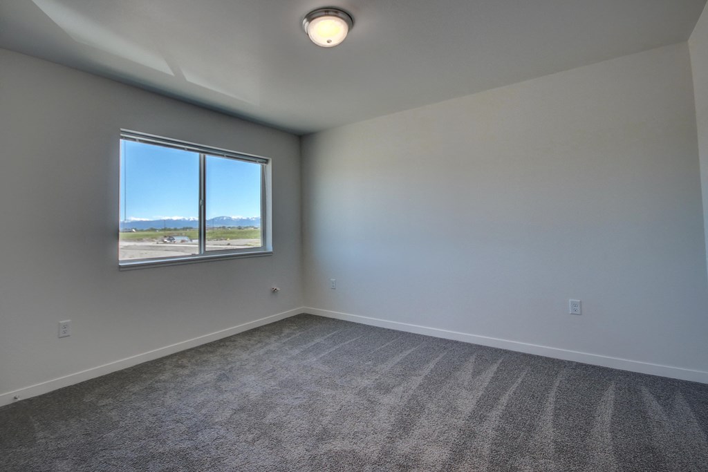 3-Bedroom Living Room at Yellowstone Landing Apartments in Belgrade, MT