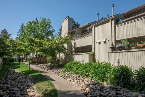 Apartment building with pathway and landscaping