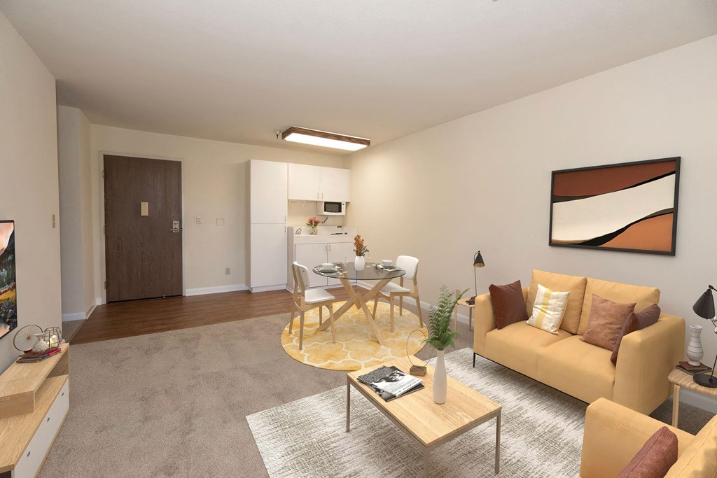 a living room and dining room with a table and chairs at Hilltop Commons Senior Living, Grass Valley