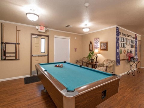 Game room with pool table at Lodi Commons Senior Living, California