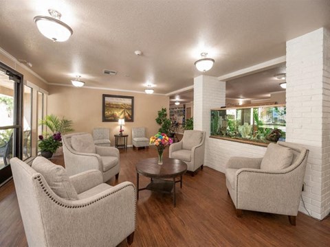 a living room with couches and chairs and a table