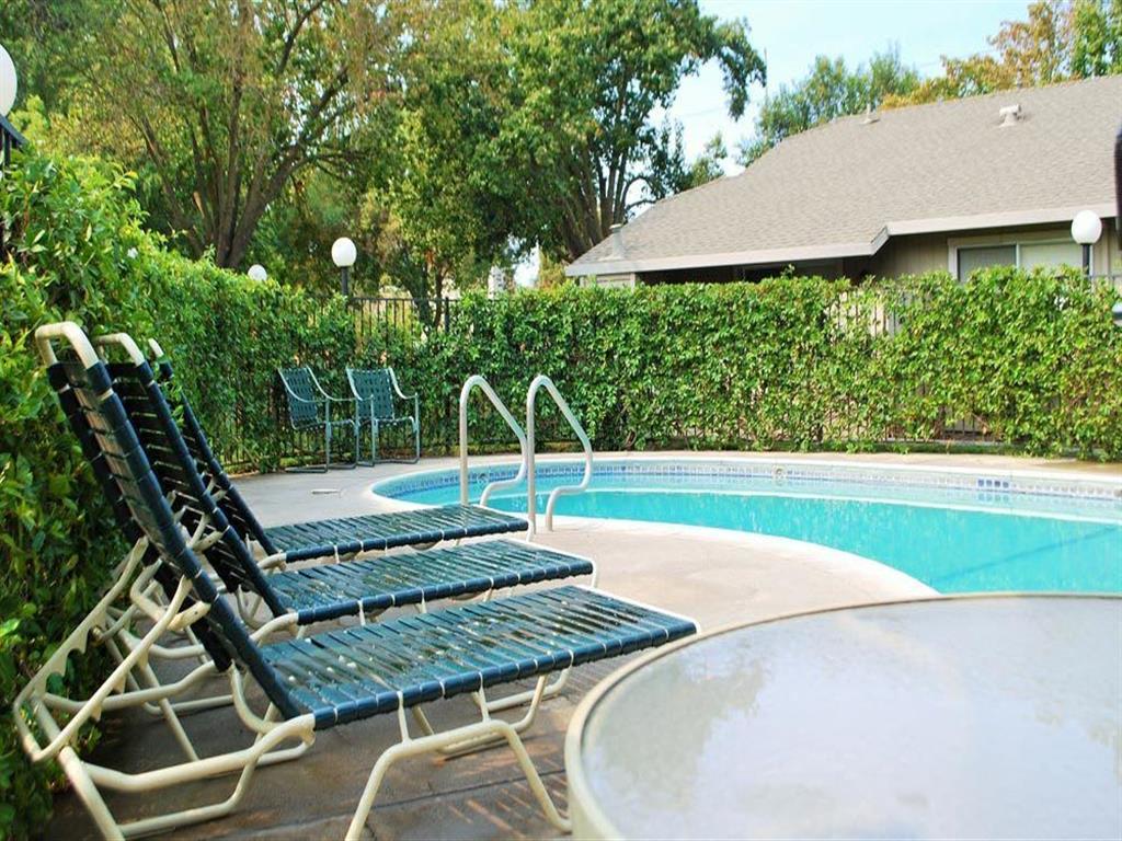 Outdoor swimming pool with chaise lounge chairs