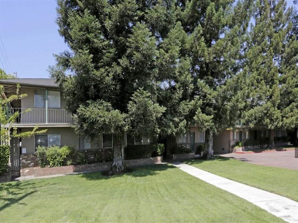 Trees in front of apartment community