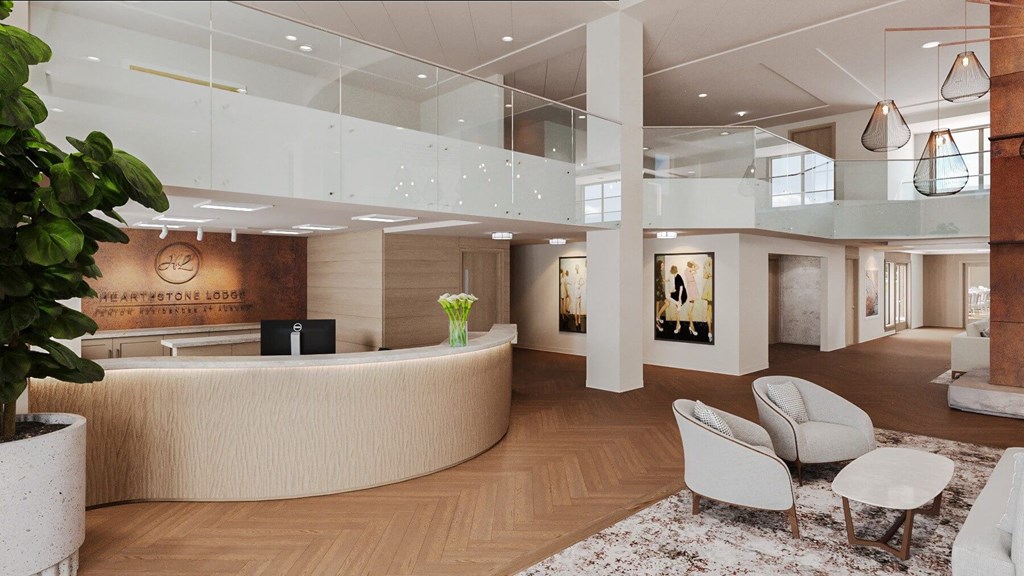 a rendering of a lobby with a reception desk and chairs at Hearthstone Lodge Senior Residences, Auburn California