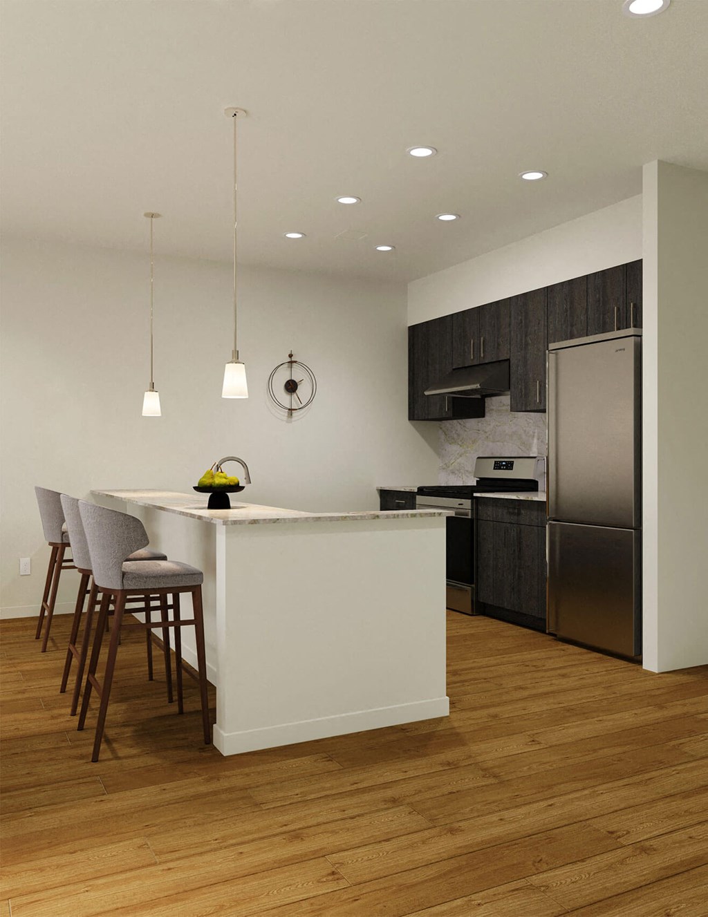 a kitchen with a large island and a stainless steel refrigerator a kitchen with a large island and a stainless steel refrigerator at Hearthstone Lodge Senior Residences, Auburn