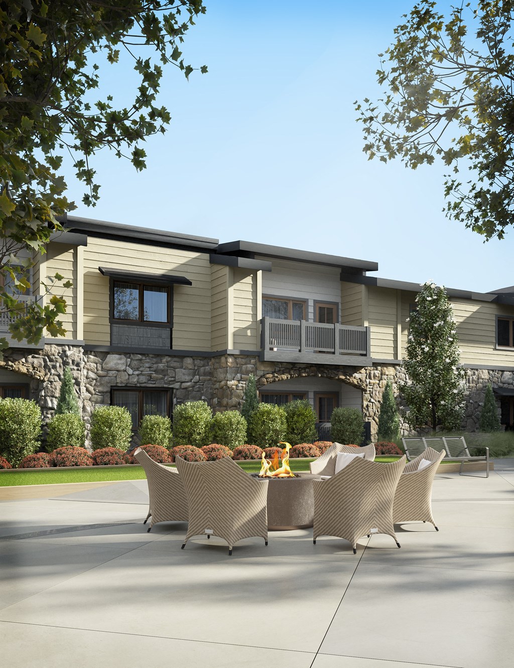 a patio with chairs and a table in front of a house