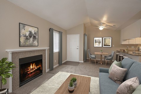 A living room with a fireplace and a couch.