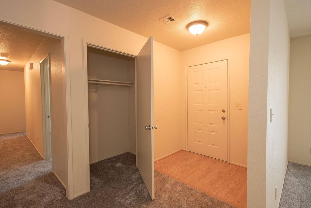 a bedroom with a closet and a door to a bathroom at Castle Vista Senior Duplex Community, Atwater, CA