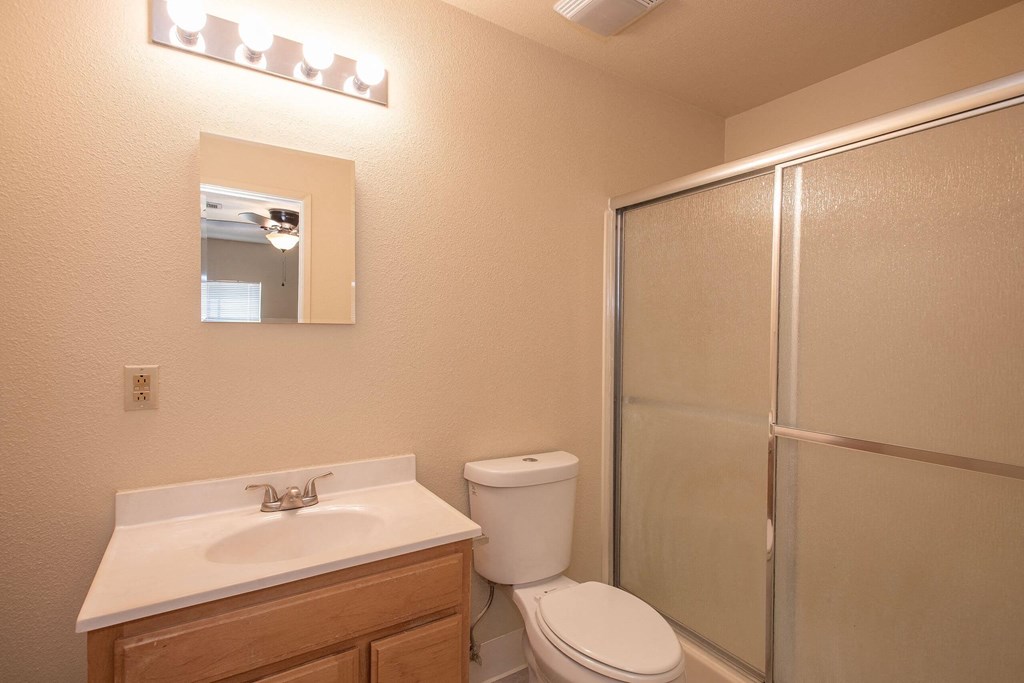 the bathroom has a large shower and a sink and a toilet at Castle Vista Senior Duplex Community, Atwater, CA, 95301