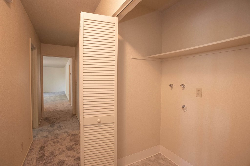 a walk in closet and a hallway in a house at Castle Vista Senior Duplex Community, Atwater, California