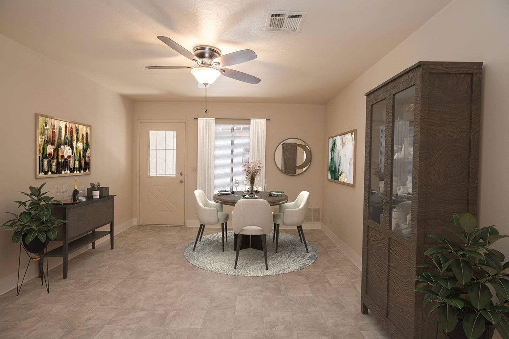 a dining room with a ceiling fan and a table and chairs at Castle Vista Senior Duplex Community, Atwater, CA