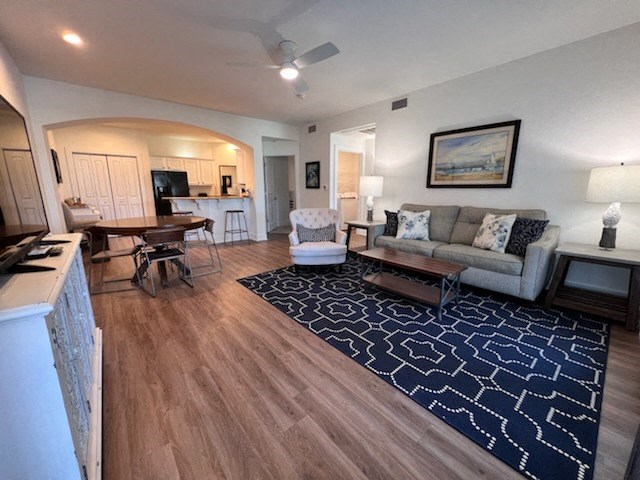 a living room with a couch and a rug