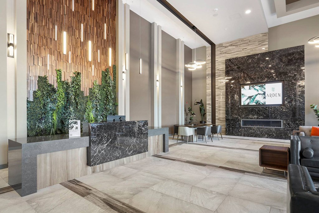 a lobby with a reception desk and a tv