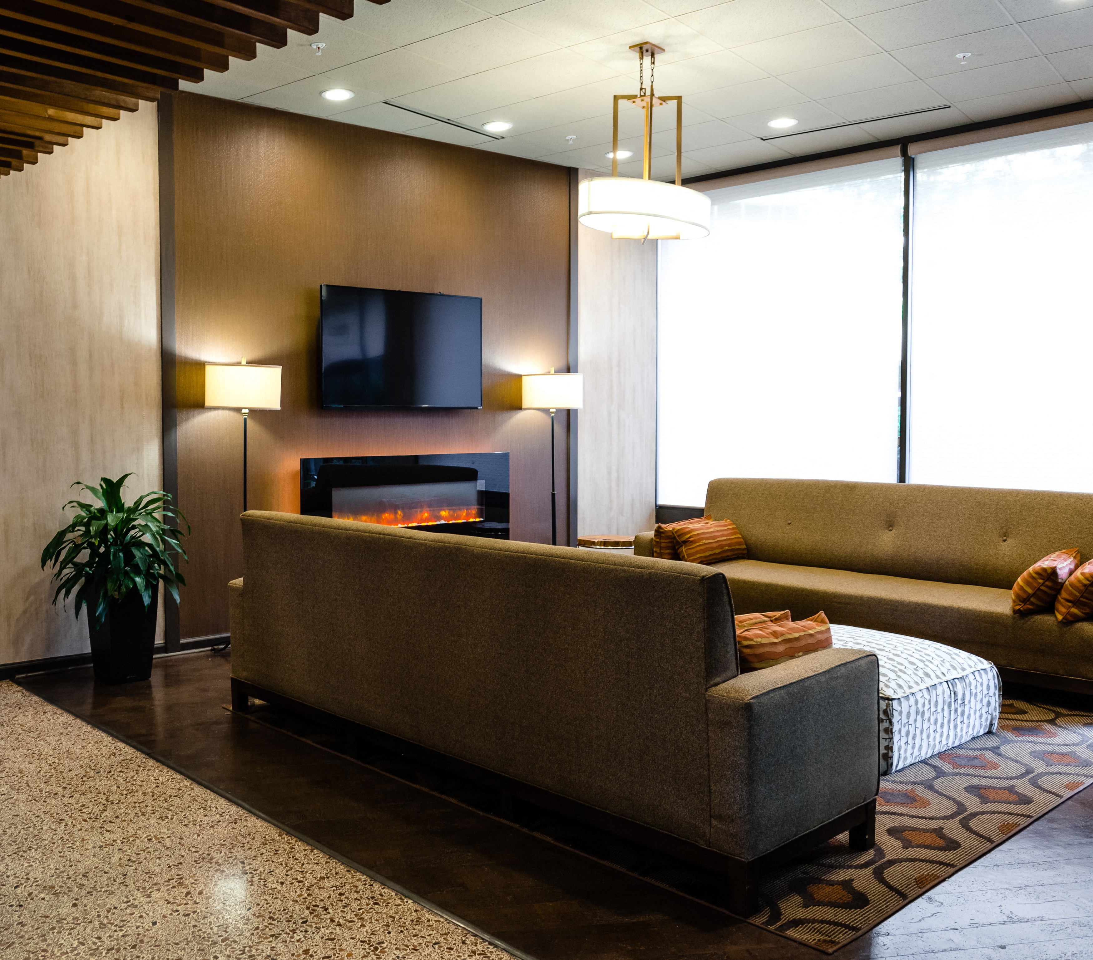 a living room with couches and a fireplace
