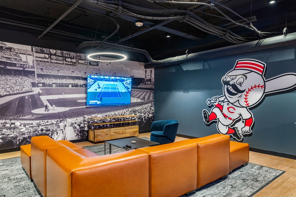 a wall mural of a baseball player in a room at Textile Apartments, Cincinnati