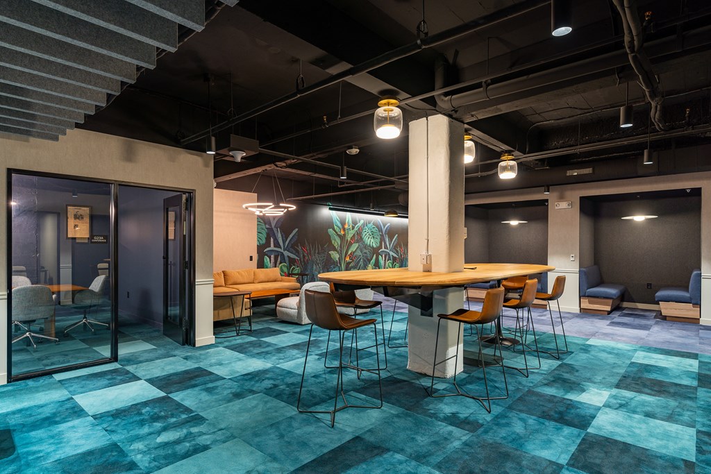 a large meeting room with a table and chairs at Textile Apartments, Ohio, 45202