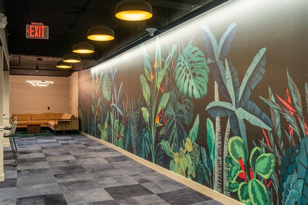 a large mural of plants on the wall of a hall at Textile Apartments, Cincinnati