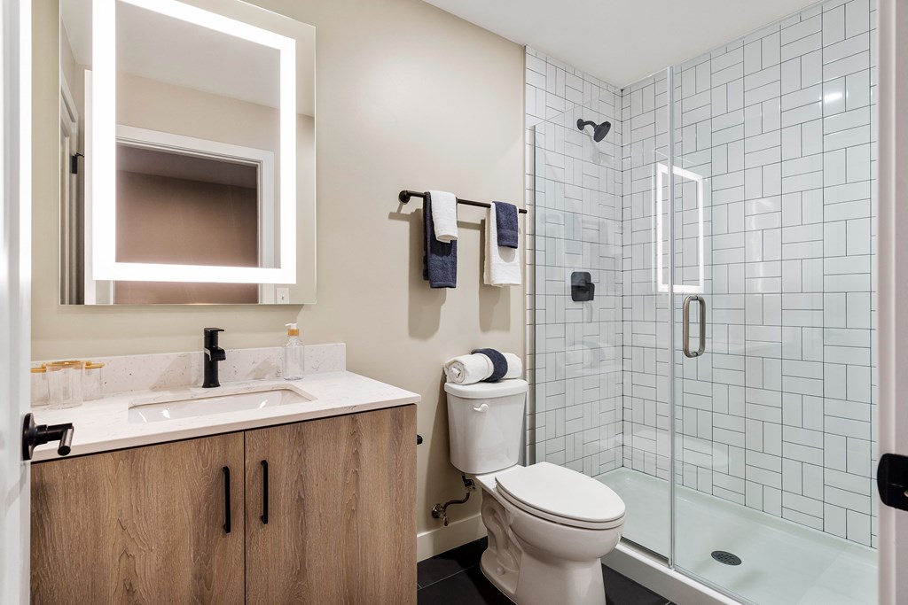 a bathroom with a toilet sink and shower at Textile Apartments, Cincinnati, OH, 45202
