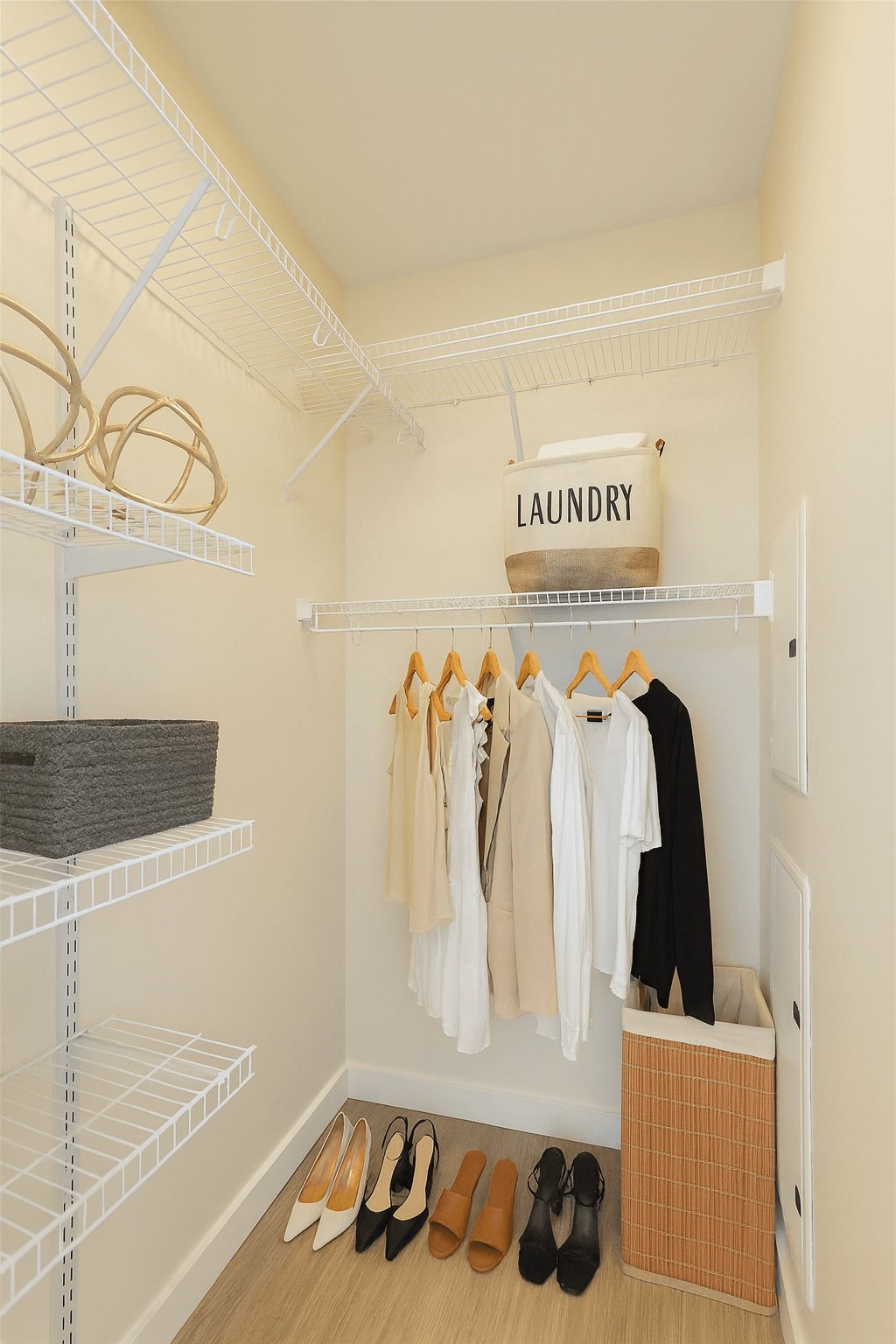 A laundry sign hangs above a rack of clothes.