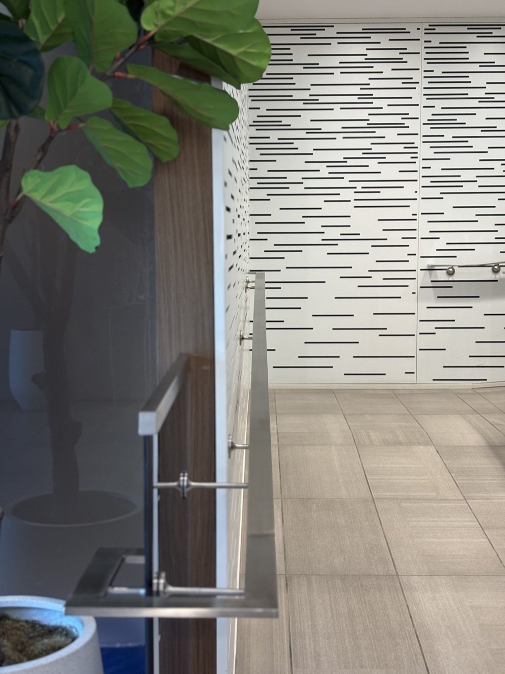 A plant is in a pot on a table.