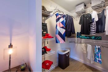 A room with a white wall and a lamp on the floor.