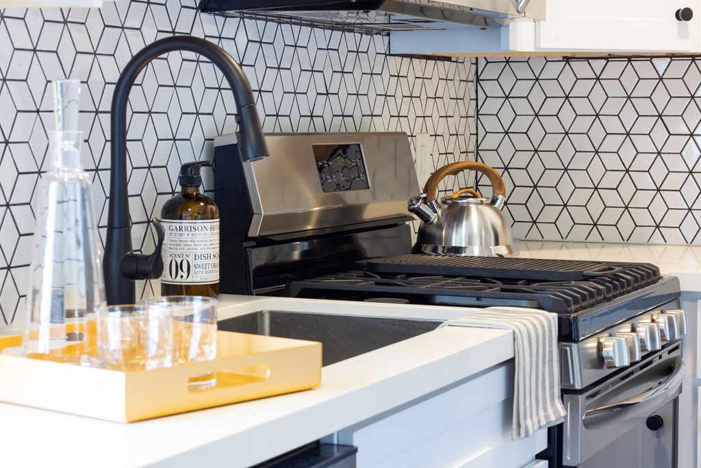 Sink and stovetop in kitchen