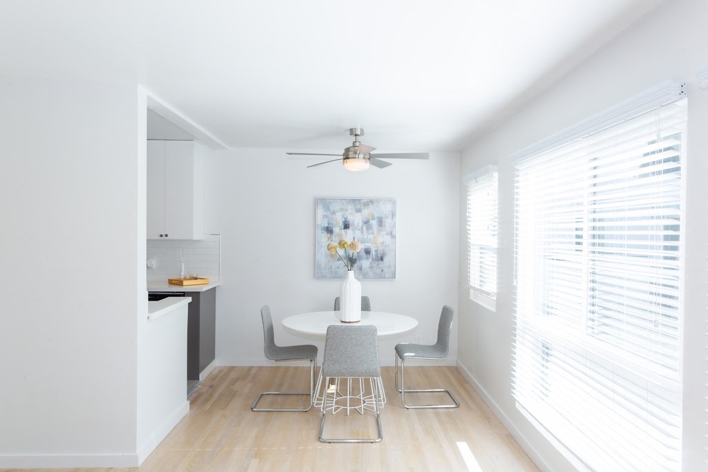 Minimally decorated dining area next to window