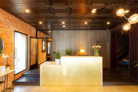 Leasing office with brick and wooden walls