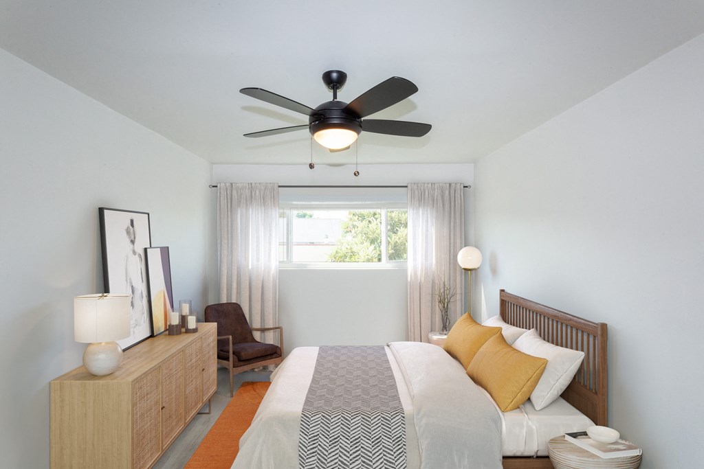 Bedroom with full bed next to window