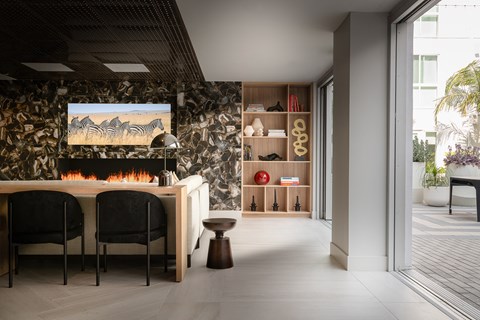 a dining room with a table and chairs and a fireplace