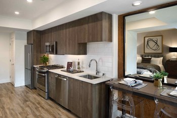 Top Kitchen Finishes Next to Dining Table - Photo Gallery 32