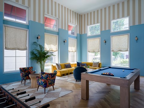 a large room with a table and chairs in it