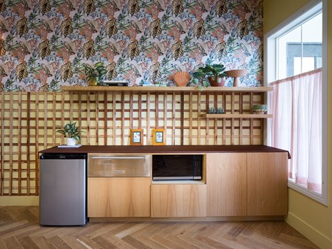 a kitchen with a counter top and a refrigerator