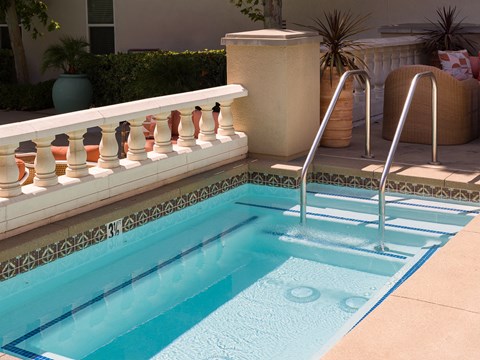a swimming pool with a ladder in the middle of it