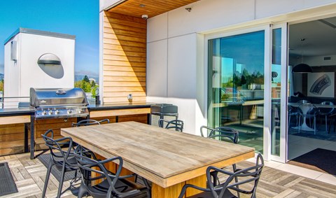 Rooftop table and BBQ above Portland