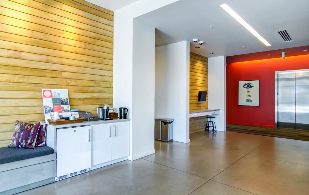 Lobby area with elevator and a coffee station